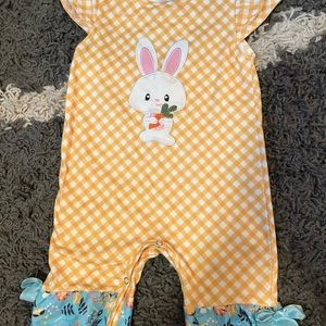 An Easter jumper yellow and white with a blue and a bunny. Boutique outfit.
